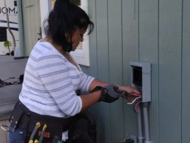 Licensed electrician wiring an exterior subpanel in Gardner