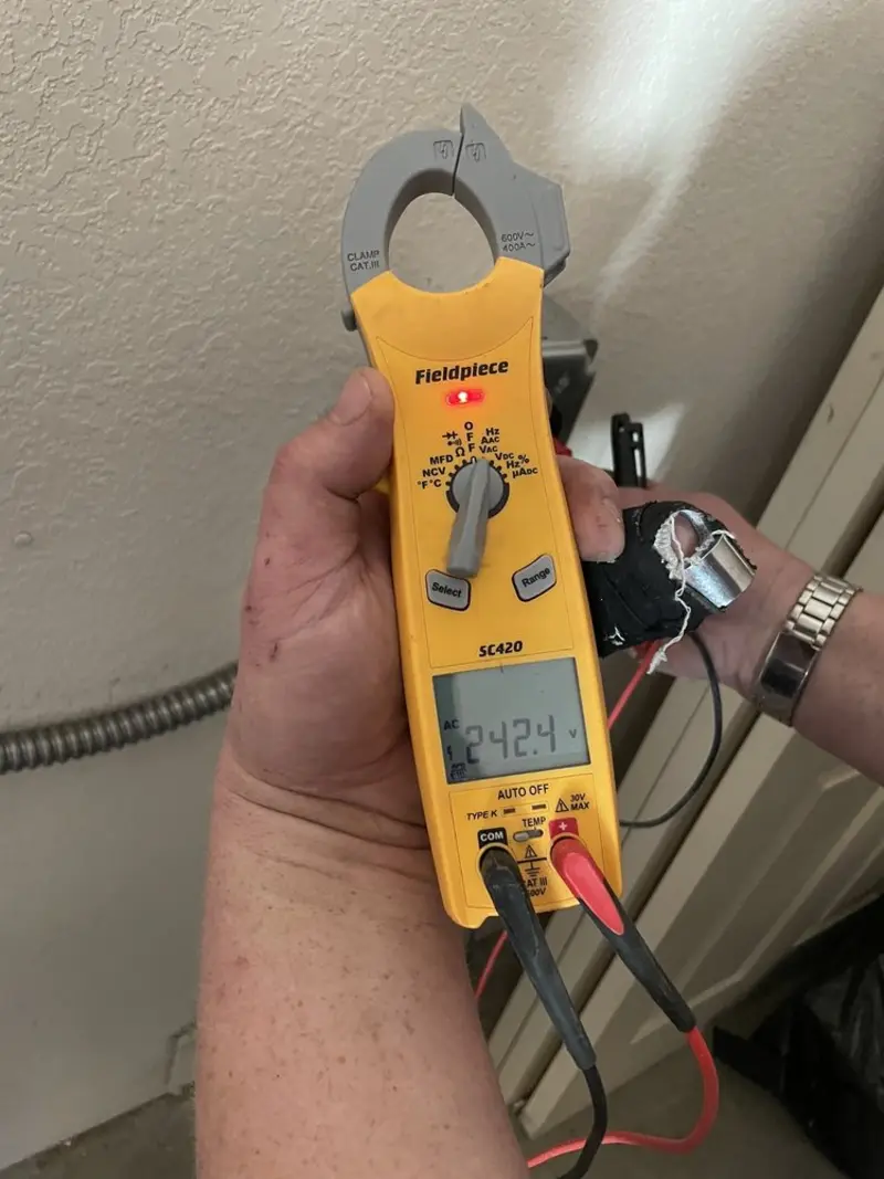 Voltage testing with clamp meter during Ceiling Fan Installation in Gardner
